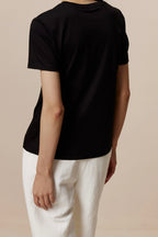 back of women in black Tee