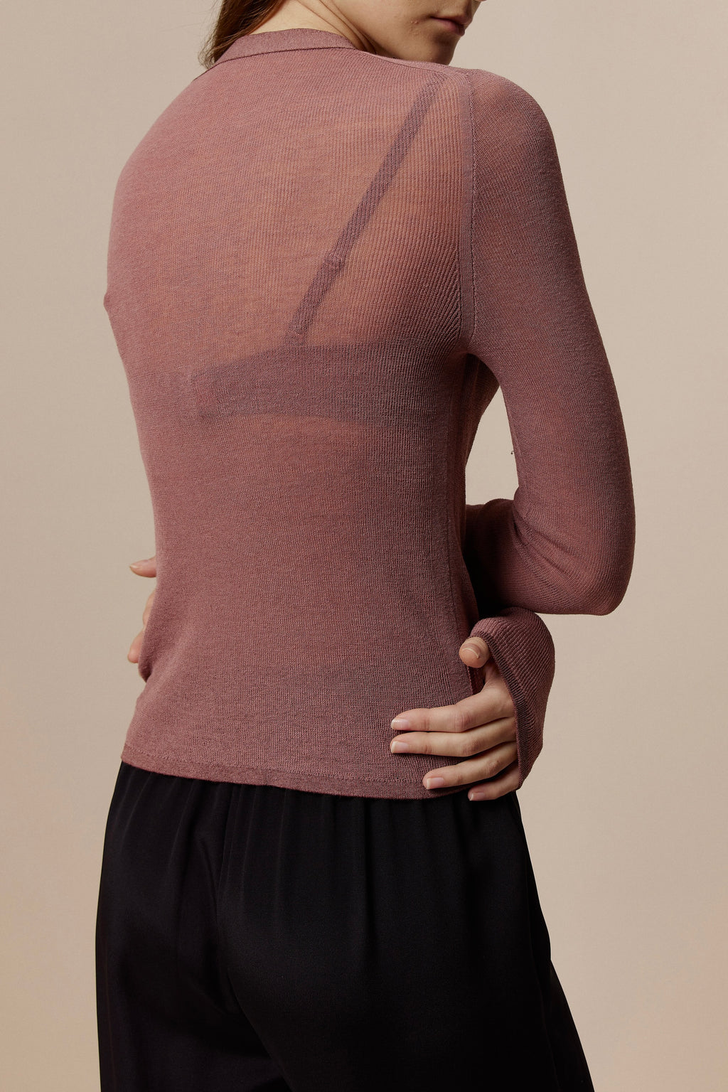 back of Women in Red Knitted Cardigan
