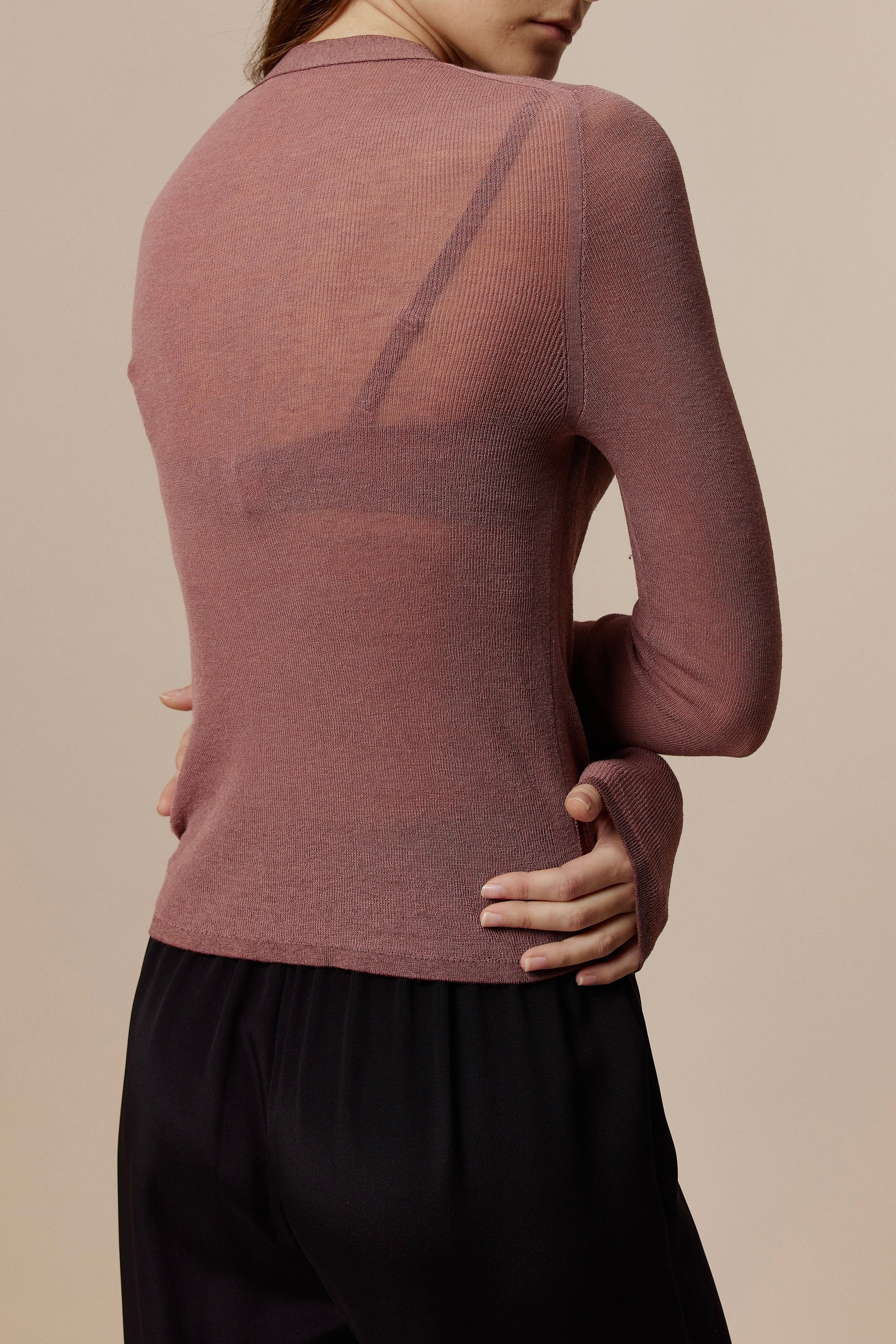 back of Women in Red Knitted Cardigan