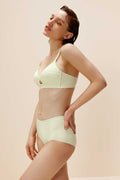 woman in light yellow bra and brief