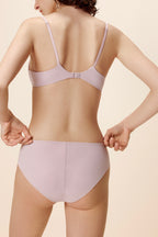 back of women in light purple bra and brief