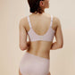 back of woman in off white bra and brief