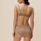 back of woman in tan bra and brief