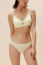 woman in light yellow bra and brief