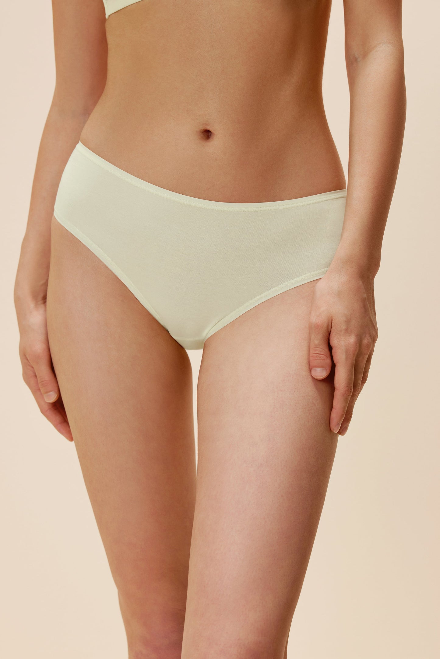 woman in light yellow brief