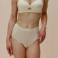 woman in light yellow bra and brief