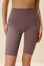 woman wearing light purple biker shorts