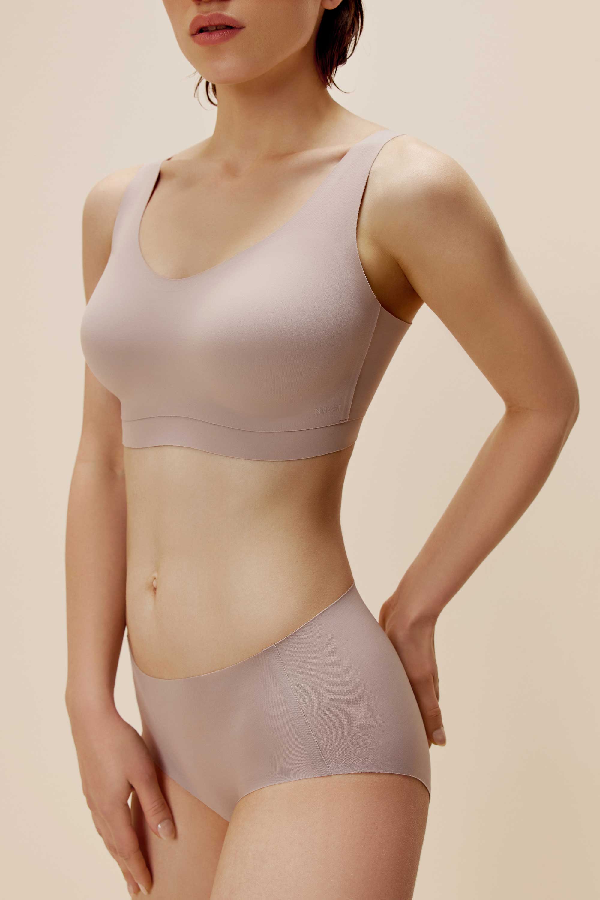 woman wearing light purple bra and panties