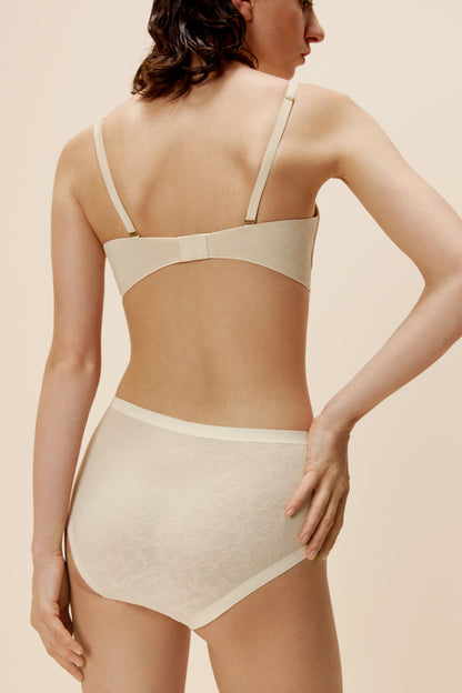 woman wearing ivory bra and brief back