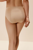 back of woman in tan underwear