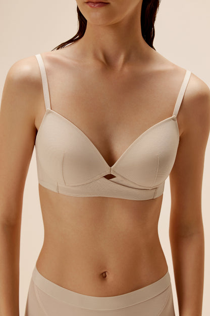 woman wearing beige bra and brief