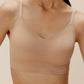 front close look of a woman wearing nude color bra