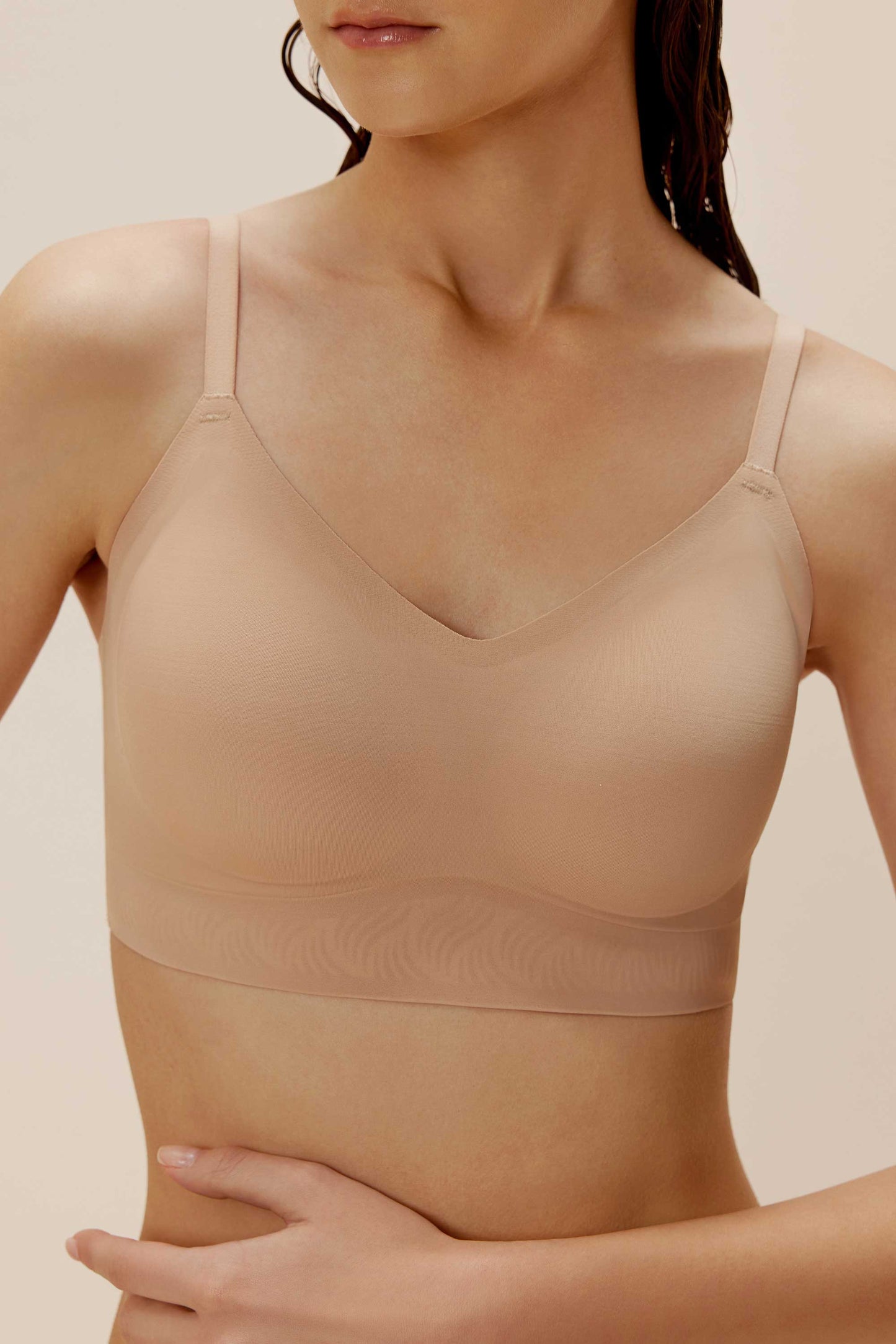 front close look of a woman wearing nude color bra