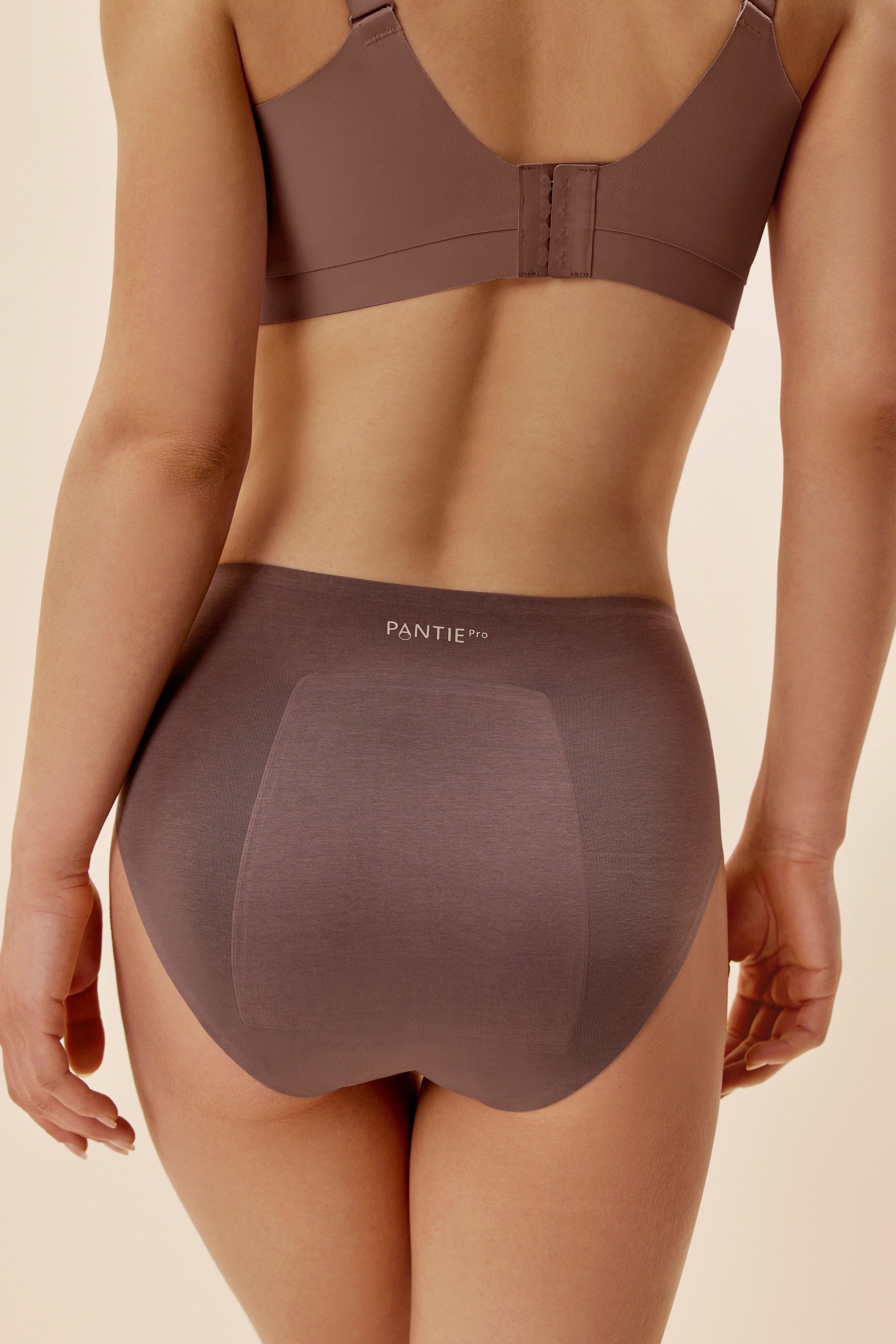 back of woman in purple underwear