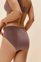 side of woman in woman in purple bra and underwear