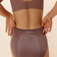 back of woman in woman in purple bra and underwear