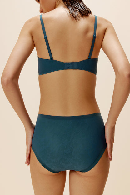 woman wearing blue bra and brief