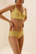 woman wearing yellow bra and brief