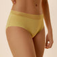 A woman wears a yellow brief.