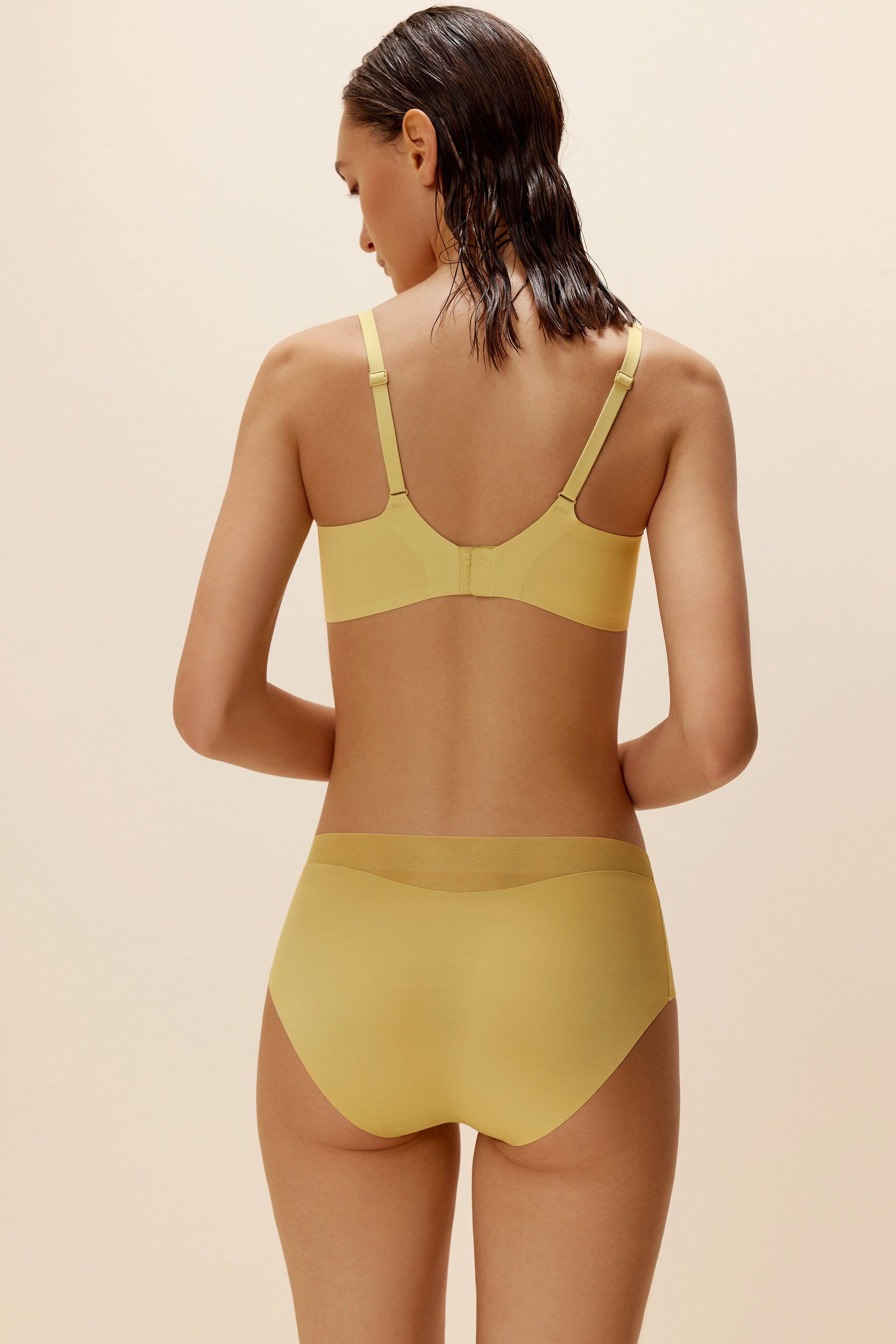 woman wearing yellow bra and brief back