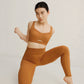 woman in mustard sports bra and leggings