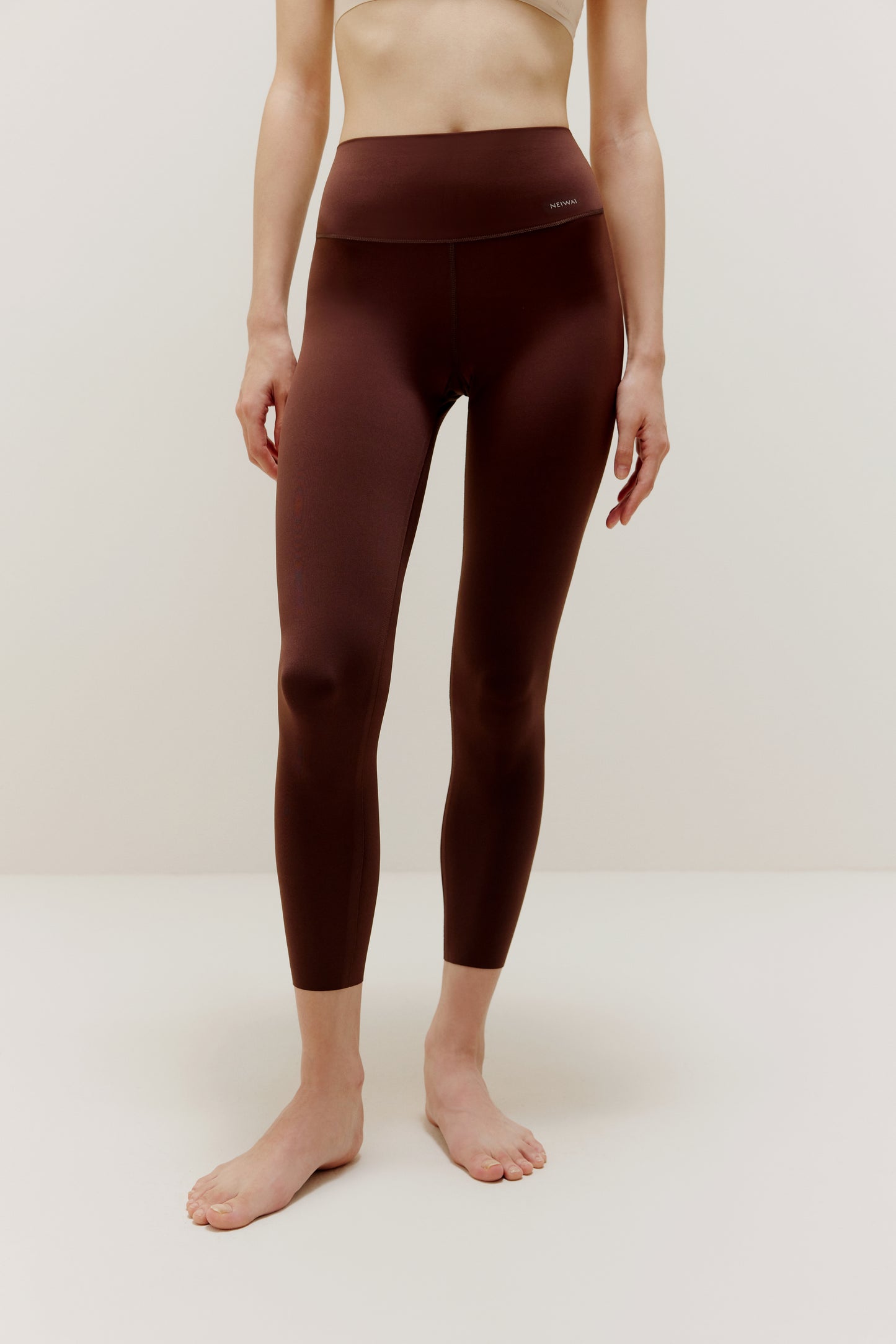 Woman wearing brown leggings