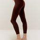 Side view of woman wearing brown leggings