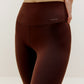 Close up waist band of woman wearing brown leggings