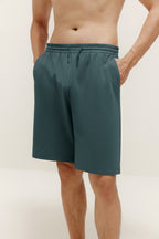 man in green shorts. Bluegrass color.