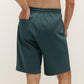 back of man in green shorts