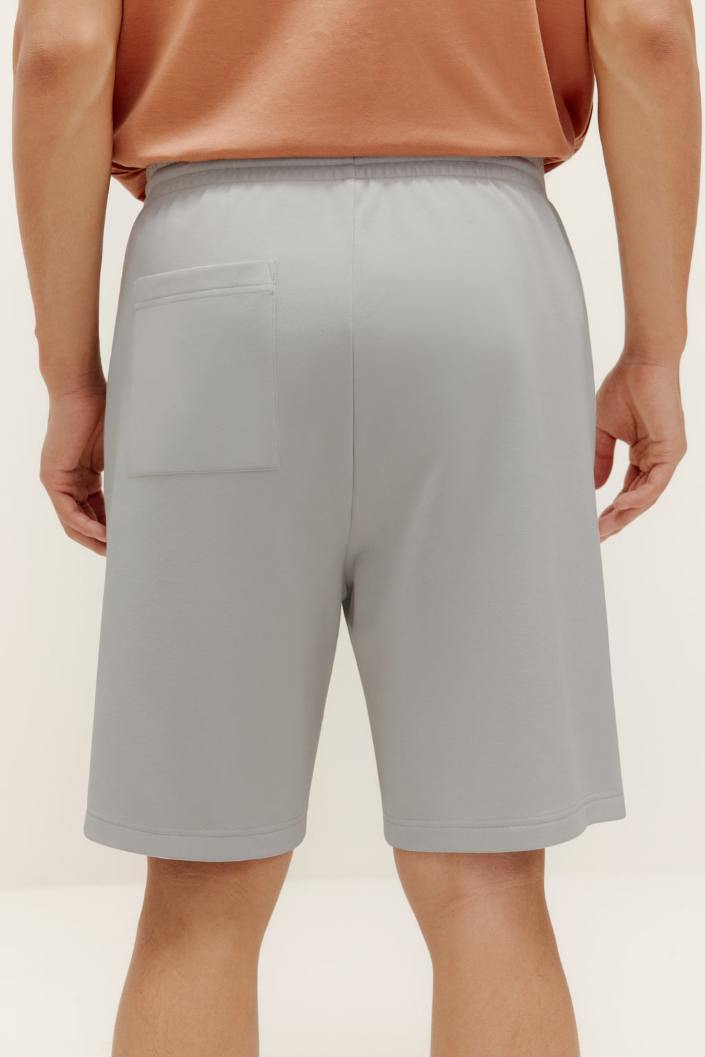 back of man in grey shorts