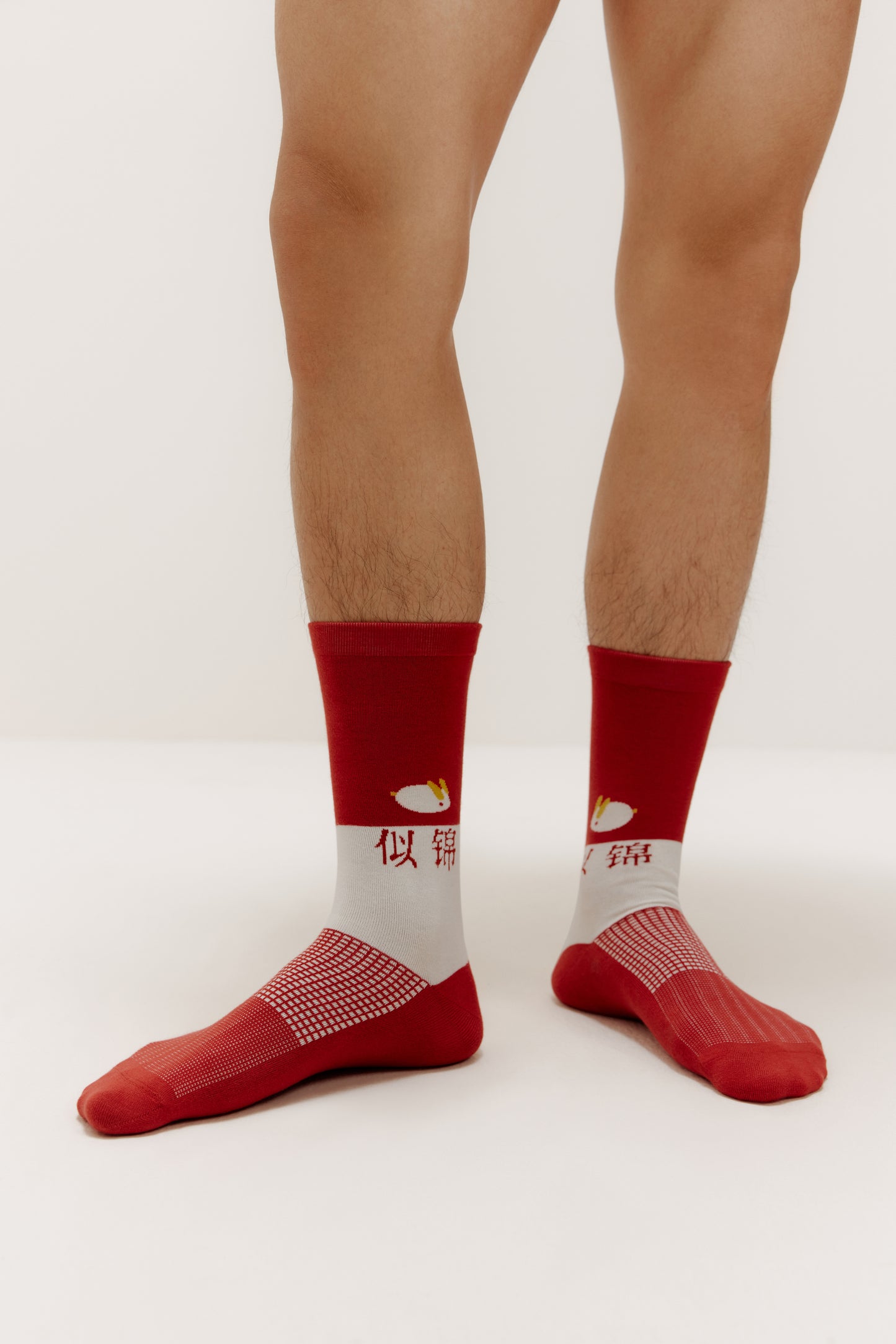 man's feet wearing a pair of socks