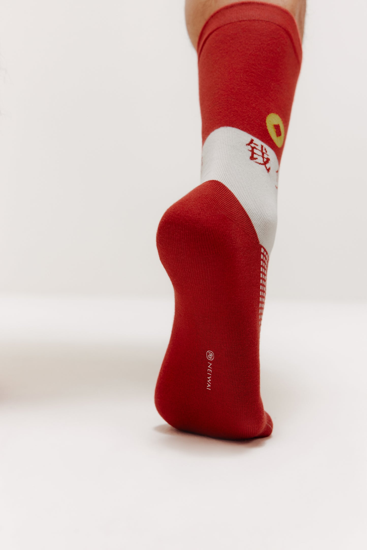 man's right foot waring red sock