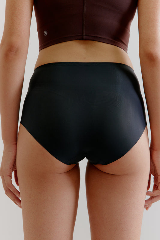 back of a woman wearing a black brief 
