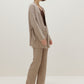 woman in knitted brown cardigan and pants