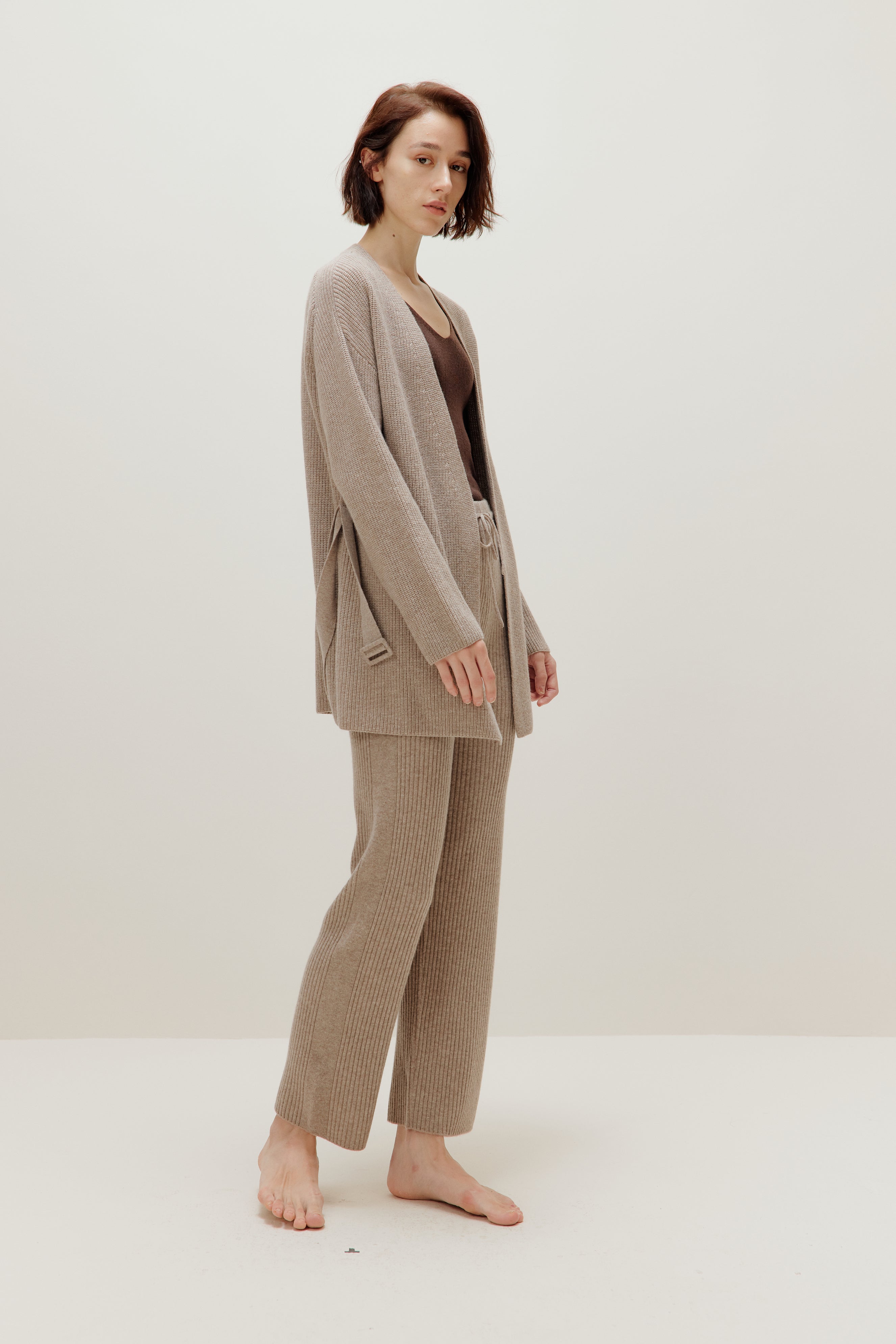 woman in knitted brown cardigan and pants