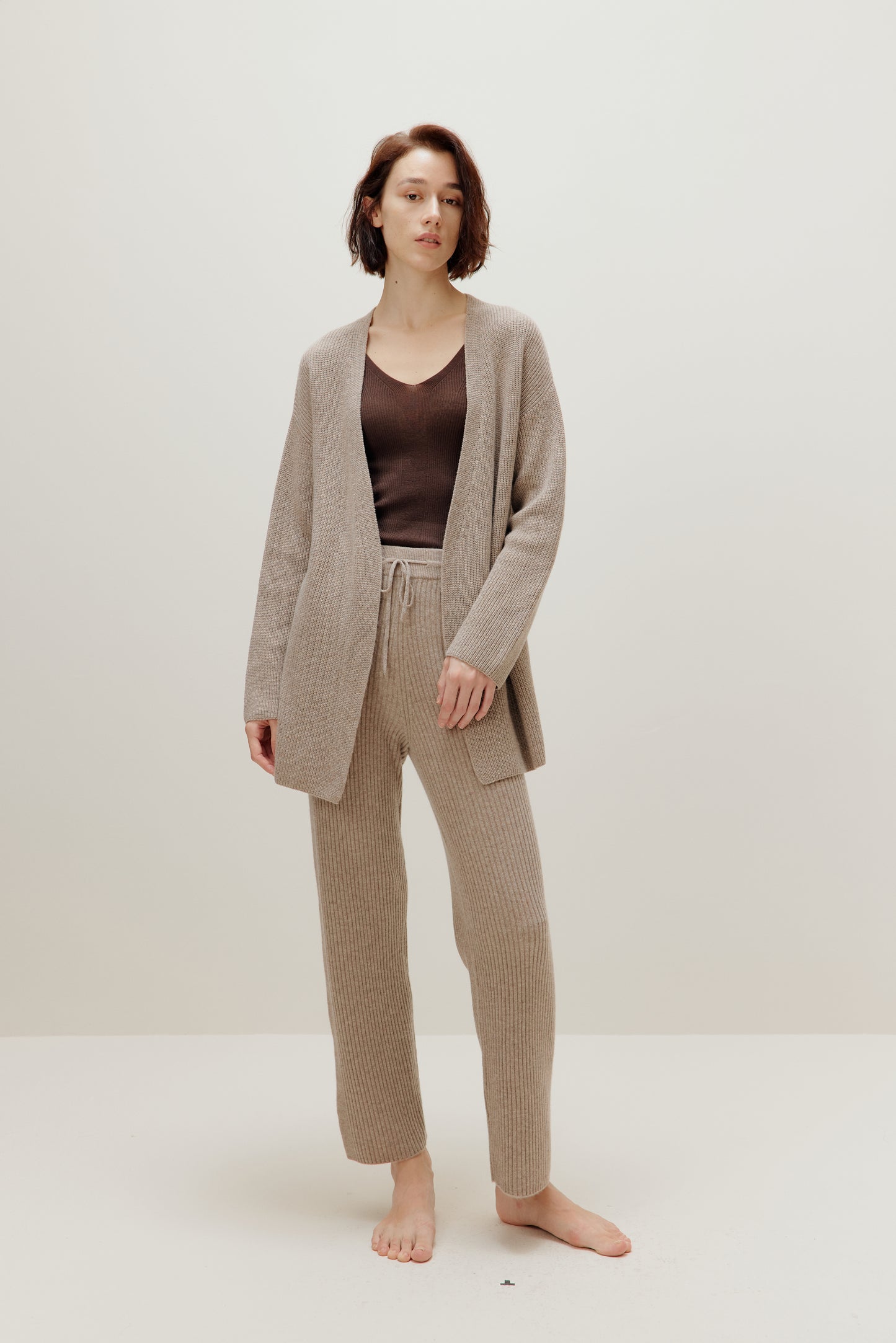 woman in knitted brown cardigan and pants