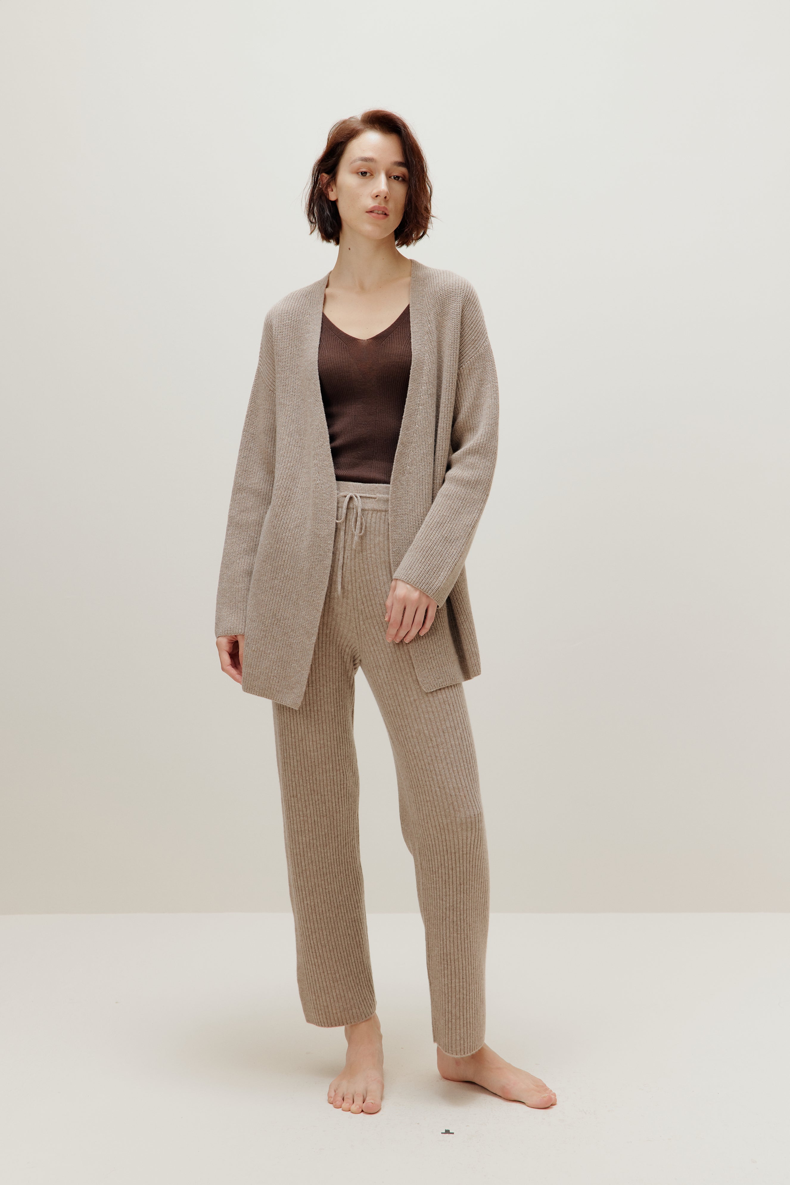 woman in knitted brown cardigan and pants