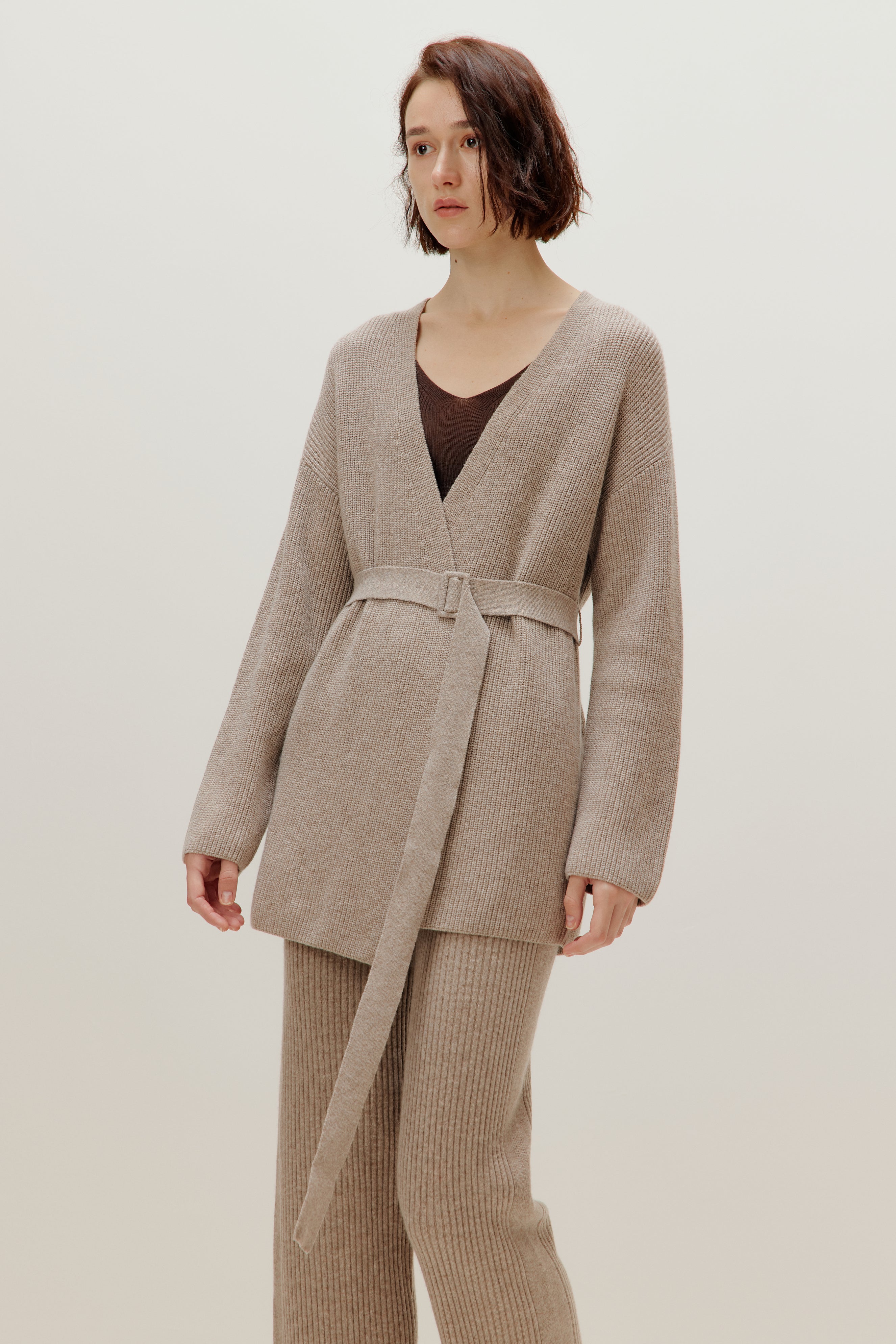 woman in knitted brown cardigan and pants
