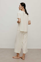 woman in off white pajama set