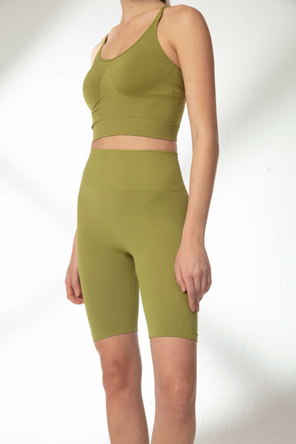 green sports bra and green biker shorts