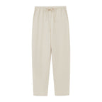 a pair of cream color pants 