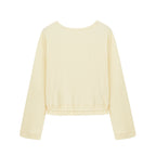flat lay image of yellow pajama top from top