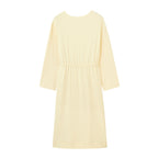 flay lay image of the long sleeve yellow pajama dress with waist drawstring from back