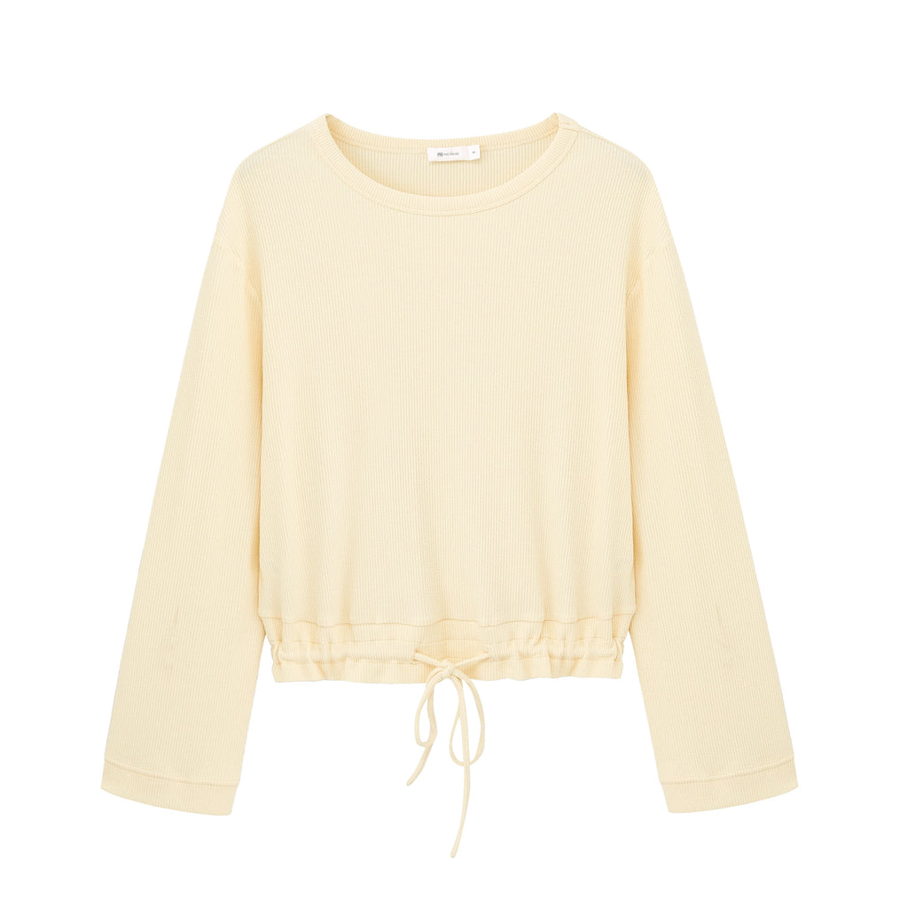 flat lay image of yellow pajama top