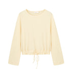 flat lay image of yellow pajama top