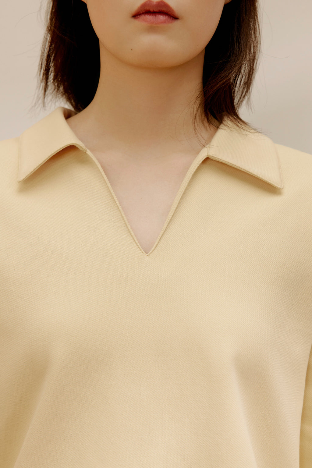 close up view of women in the yellow polo shirt