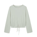 flat lay image of mint pajama top