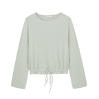 flat lay image of mint pajama top