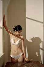 Woman in white bra and panties